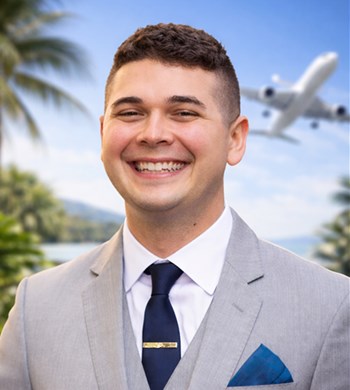 Headshot of Michael McWhorter, co-owner of McKahn Cruises, in a light grey suit